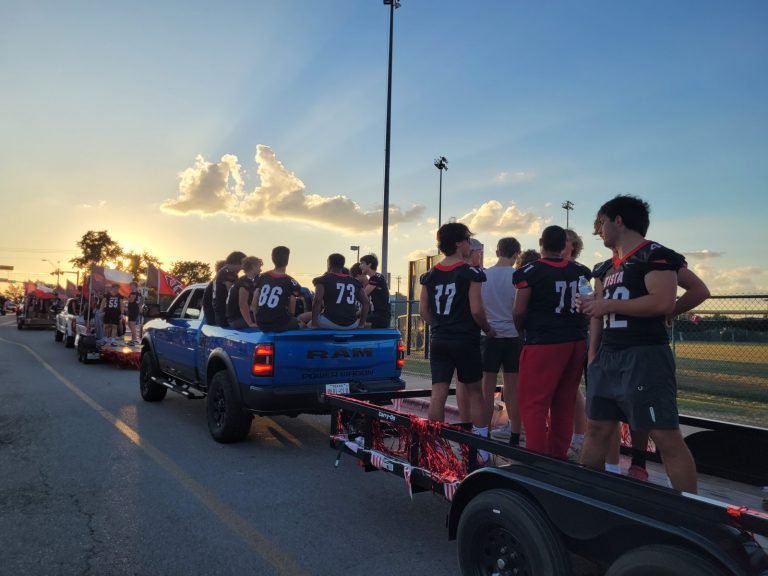 The team on the float, Homecoming 2025